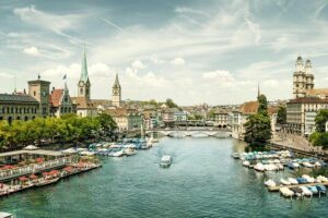 Zurich Sights: Cruise, Lindt Chocolate and optional FIFA Ticket - Altstadt essentials: St. Peter, Fraumünster, and the guild houses